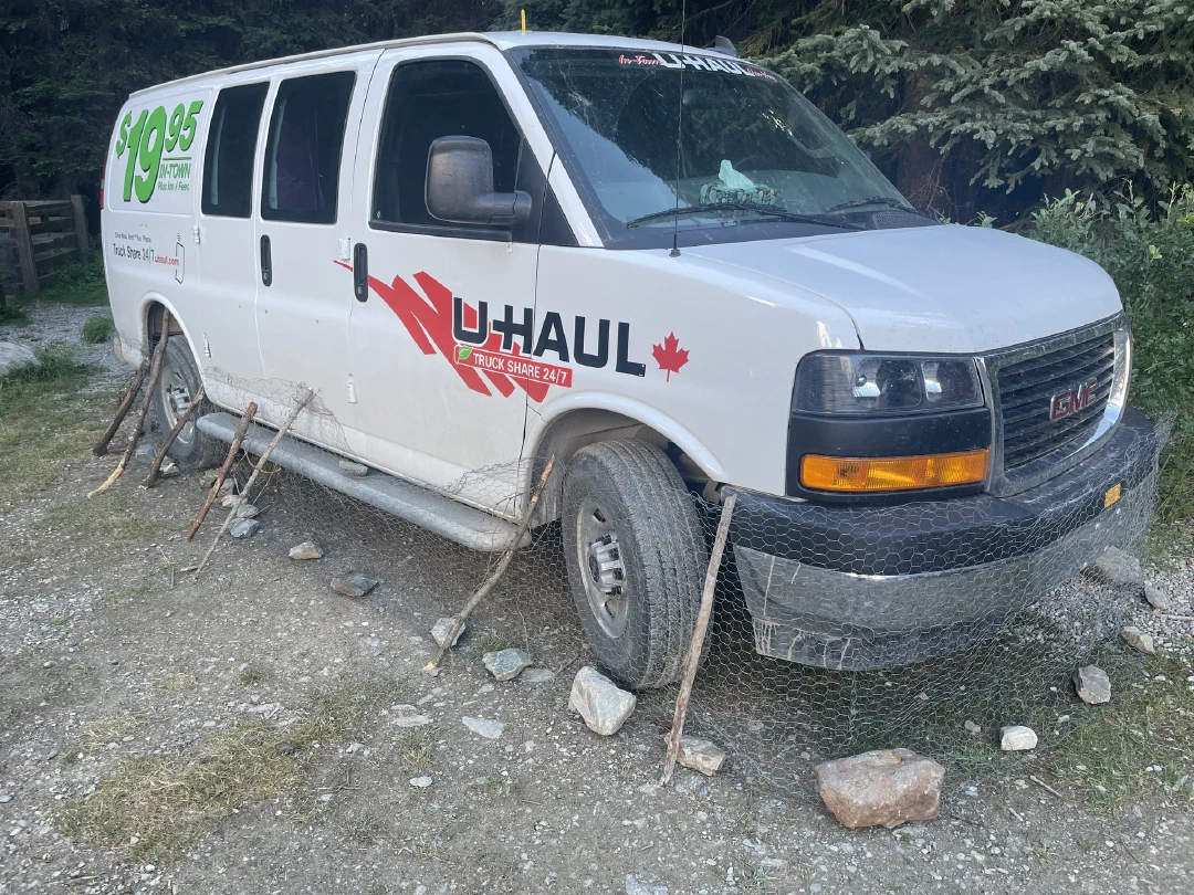 A U-Haul van wrapped in chicken wire, same as the rest
