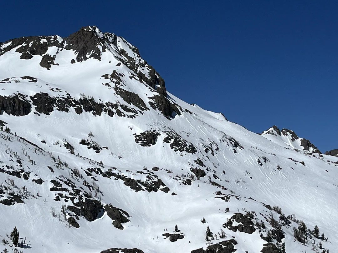 Wind-scoured crust and loose wet snow flanking Round Top.