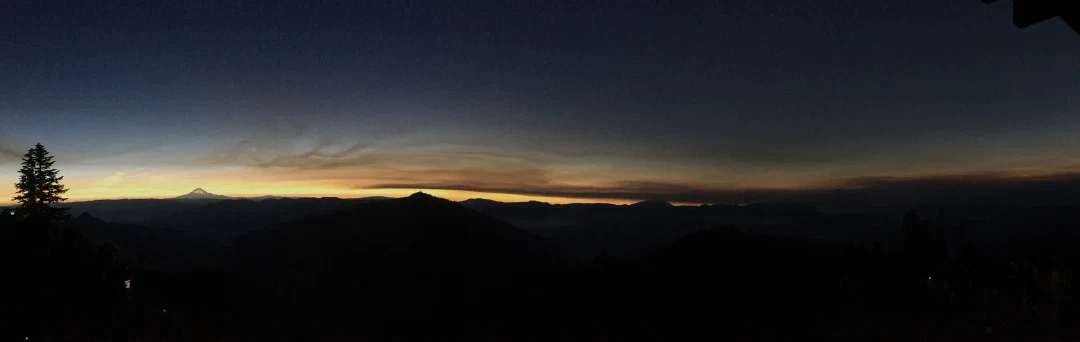 Panorama from inside the moon’s shadow, near-night overhead and a band of orange twilight catching Mt Hood