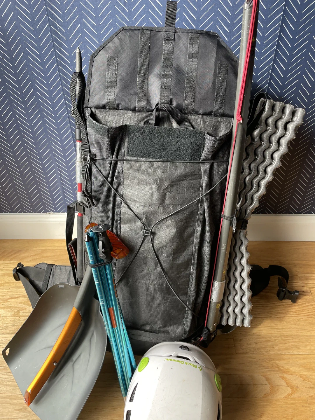 Tool pocket flap open, staged with winter kit.