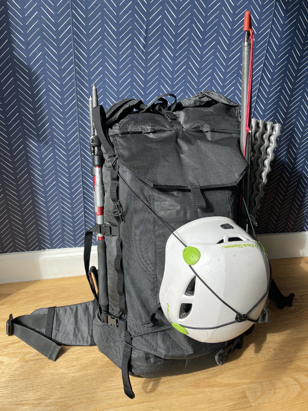 Loaded with rock helmet bungeed on front. Poles, ice axe and foam pad clipped to sides.