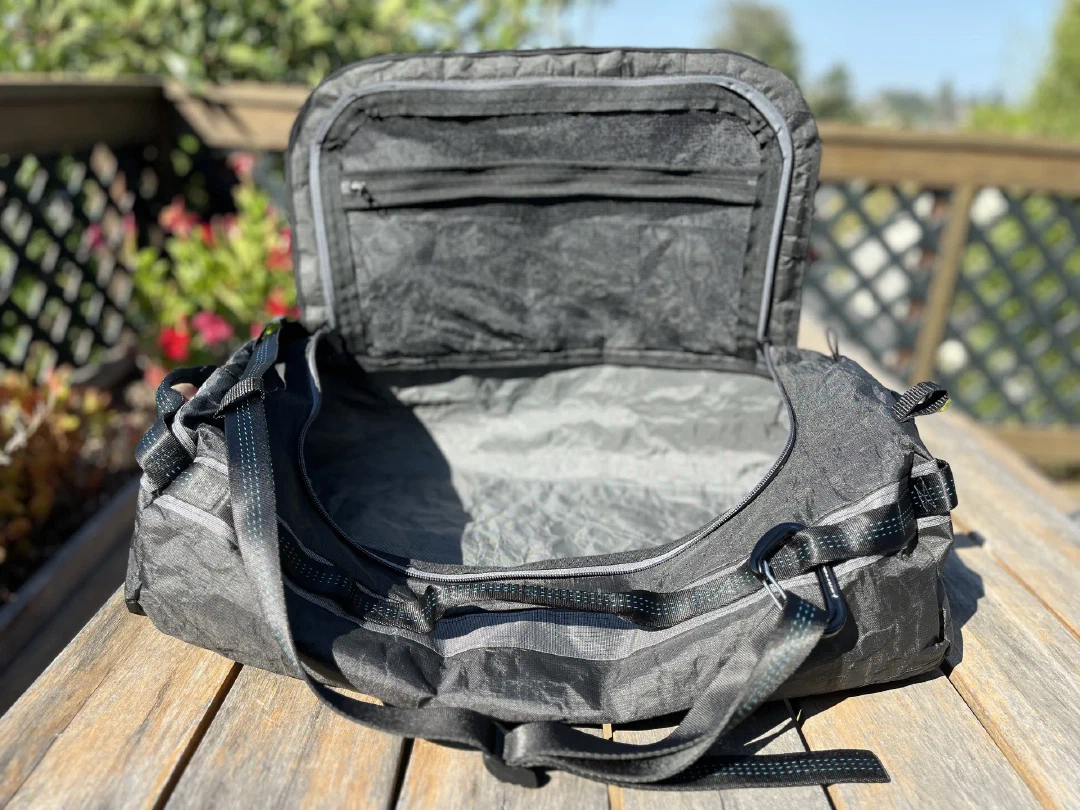 Lid open on the first build, grey liner and zippered mesh pocket inside