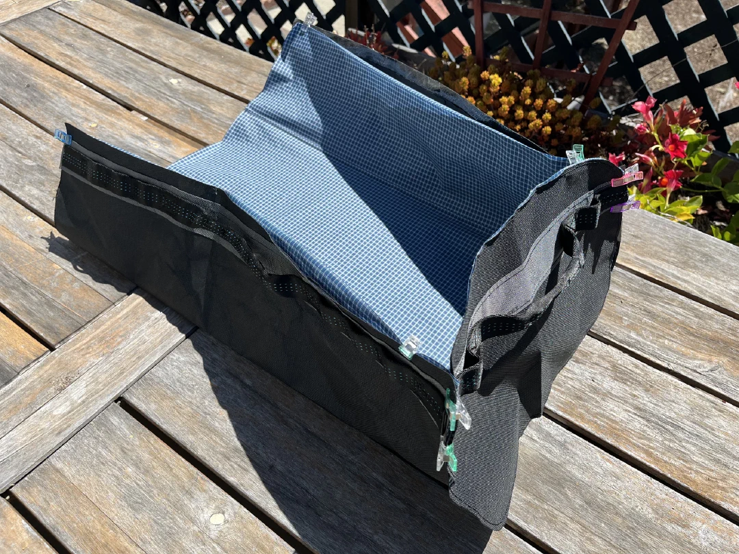 The blue gridstop liner taking shape inside out on a deck table